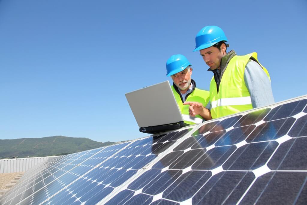 Engineers checking solar panel setup